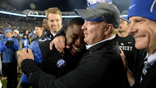 UK RB Jojo Kemp is hugged by head coach, Mark Stoops, after the University of Kentucky Wildcats Football game against the South Carolina Gamecocks in Lexington, KY. Saturday, October 4, 2014. By Mike Weaver, Special To The CJ, Imagn Images